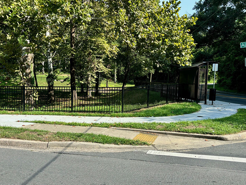 Picture of new sidewalk and fencing